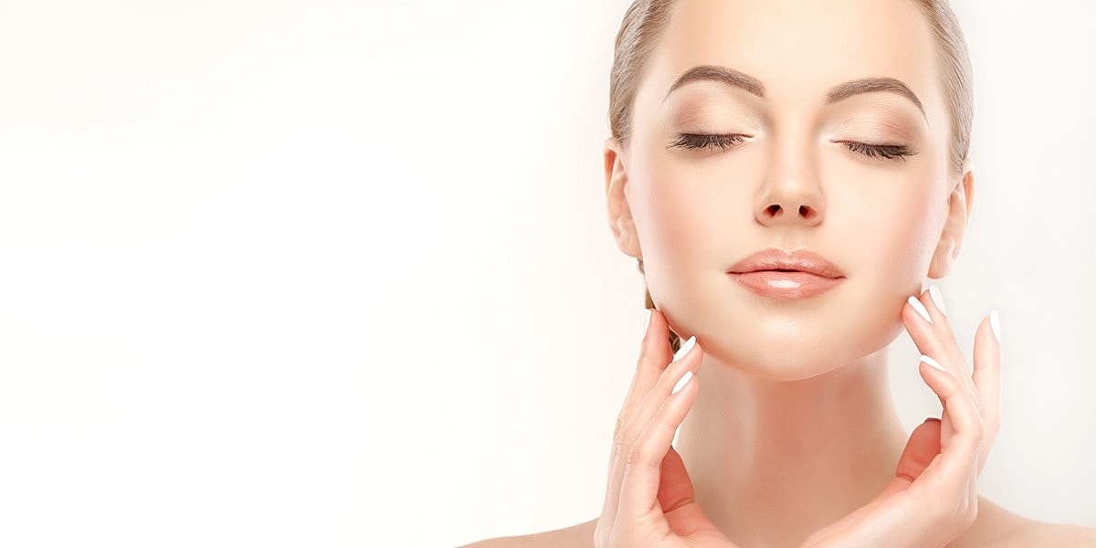 Woman with glowing skin and gentle expression.