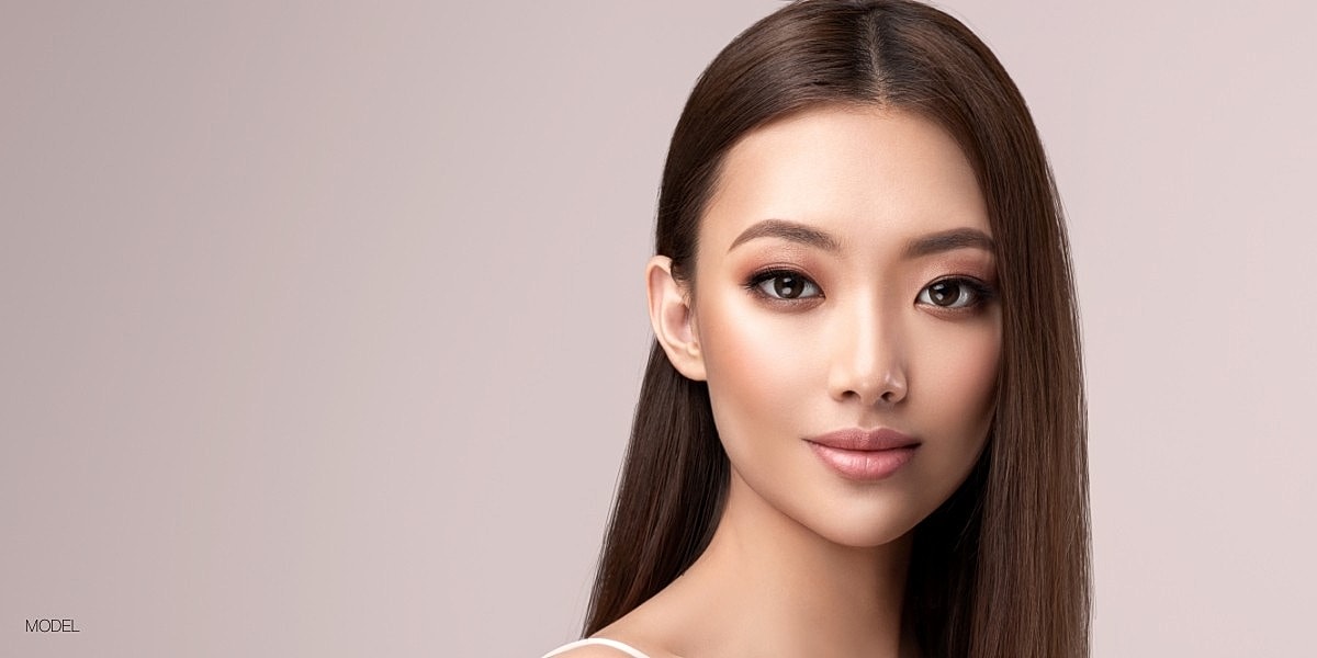 Model showcasing natural beauty and makeup.