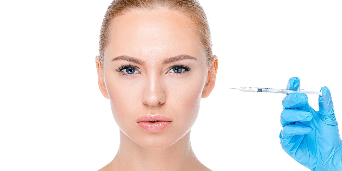 Woman preparing for cosmetic injection treatment.